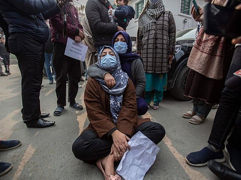 A family member of one of the civilians killed in Srinagar. Relatives and friends have been demanding that authorities return the dead bodies of Gul and Bhat for a proper burial.