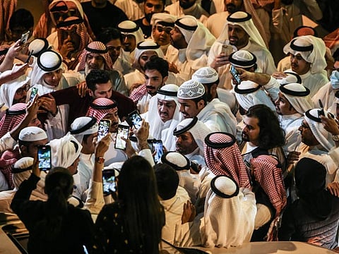 Former Kuwaiti MP Musallam Al Barrak is surrounded by supporters upon his arrival from Turkey in Kuwait City, on November 17, 2021.