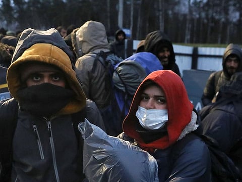 Migrants gather at a transport and logistics centre near the Belarusian-Polish border in the Grodno region, Belarus.