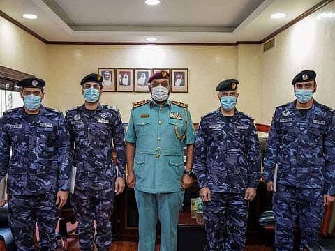 Members of the Ajman Police Special Task Force at the honouring ceremony, along with Brigadier General Mohammad Shaiban Suwaidan.