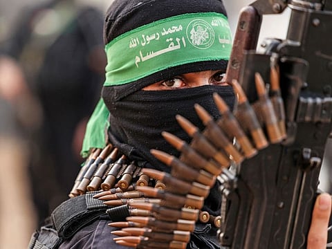 A member of Ezzedine Al Qassam Brigades, military wing of the Palestinian Hamas movement, takes part in a parade in Gaza City.