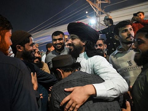 Saad Rizvi (centre), head of the Islamist religious party Tehreek-e-Labbiak Pakistan (TLP), celebrates with supporters following his release from detention, in Lahore on November 18, 2021. Fawad Chaudhry while indirectly commenting on the recent violent incidents said the state and the government were in a way, helpless before these extremist outfits and their leaders.
