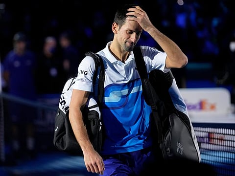 Novak Djokovic leaves the court after losing to Alexander Zverev in their ATP World Tour Finals, singles semifinal, tennis match, at the Pala Alpitour in Turin, Italy. Zverev won 7-6/4-6/6-3.