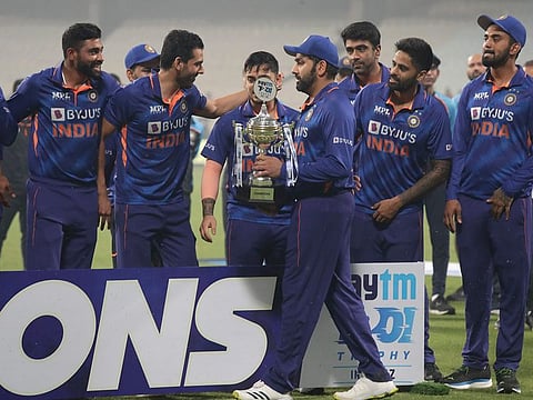 India's T20 captain and Player of the Series, Rohit Sharma, carries the series winners' trophy for the photo call at the Eden Gardens on Sunday.
