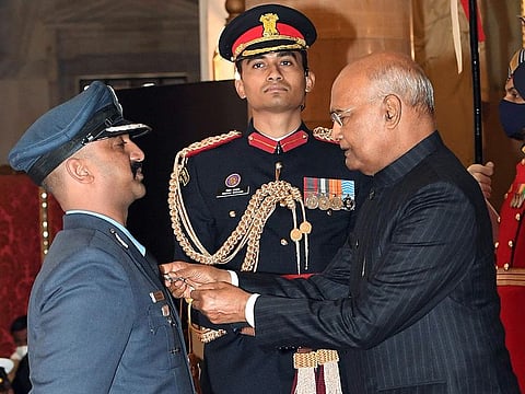 India's President Ram Nath Kovind presents Vir Chakra to Wing Commander (now Group Captain) Varthaman Abhinandan, in New Delhi on November 22, 2021.
