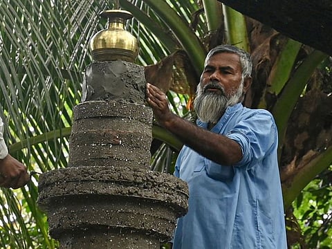 Taher Ali Khan working on a tomb at the Barisal Mahashashan Hindu crematorium ground in Barisal.