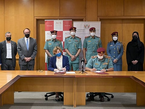 Dr Susan Mumm and Colonel Sami Khamis Al Naqbi signing the agreement at AUS on Tuesday
