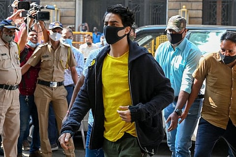 Aryan Khan (C), son of Bollywood actor Shah Rukh Khan, arrives at the Narcotics Control Bureau (NCB) office for weekly attendance in Mumbai, after he was released on bail in connection with a drug case.