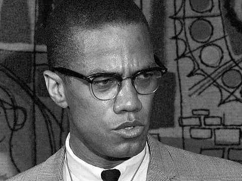 Malcolm X addresses reporters at the Hotel Park-Sheraton in New York in March 1964