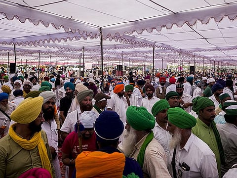 Farmers gather during the last rites ceremony for people who were killed when a vehicle ran over protesters in UP, India