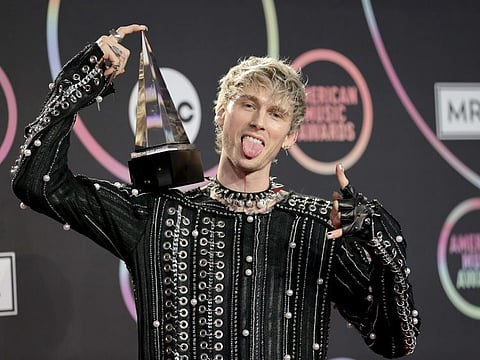 Machine Gun Kelly, winner of the Favorite Rock Artist award, poses in the Press Room at the 2021 American Music Awards at Microsoft Theater on November 21, 2021 in Los Angeles, California.