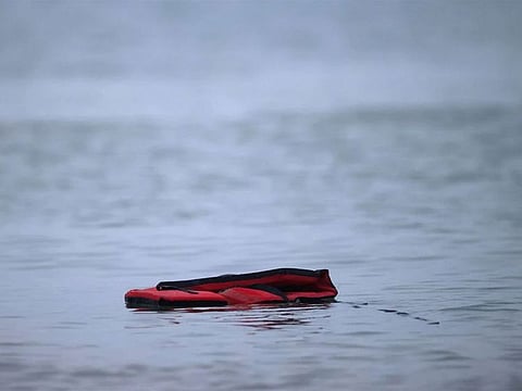 A life jacket is left after a group of migrants got on an inflatable dinghy, to leave the coast of northern France and to cross the English Channel, near Wimereux, France.