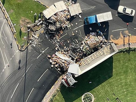 Several fallen crates of vegetables blocked the road in the incident on Sharjah Corniche Road on Wednesday