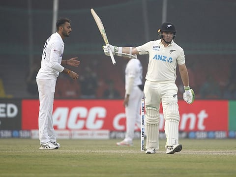 New Zealand's Tom Latham celebrates his half century during the day 2 of the first Test match between India and New Zealand, in Kanpur.