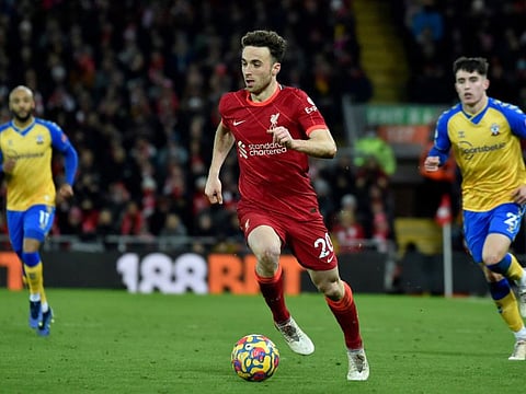 Liverpool's Diogo Jota runs with the ball during the Premier League match against Southampton at Anfield stadium, in Liverpool, England.