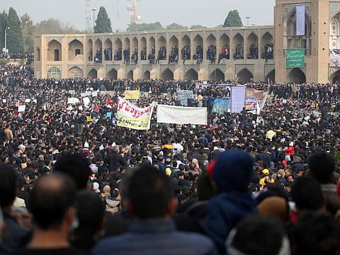 In this photo released by the semi-official Fars News Agency, farmers attend a protest demanding authorities open a dam to relieve drought-stricken areas of central province of Isfahan, on the dried up riverbed of the Zayandeh Roud river in the city of Isfahan.