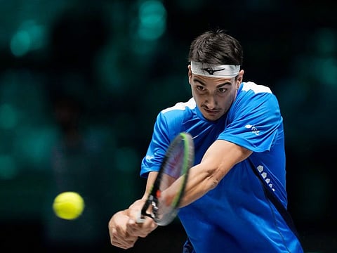 Italy's Lorenzo Sonego returns the ball to Colombia's Nicolas Mejia during their Davis Cup men's single Finals tennis match at the Pala Alpitour in Turin, Italy.