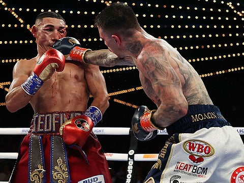 George Kambosos (right) lands a punch at Teofimo Lopez during their bout last year.