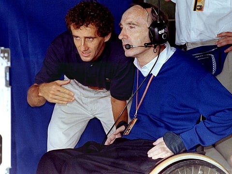 Three-time Formula One World Champion Alain Prost speaks with Frank Williams