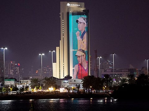 US Open champion Emma Raducanu and Olympic gold medal winner Belinda Bencic are projected on Mubadala Tower in Abu Dhabi