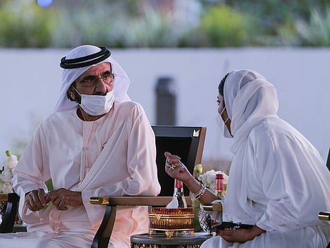 Mohammed bin Rashid with Mona Al Marri.