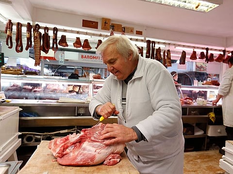 A meat vendor in Budapest. The recent pickup in inflation has caught business leaders and economists around the world by surprise.