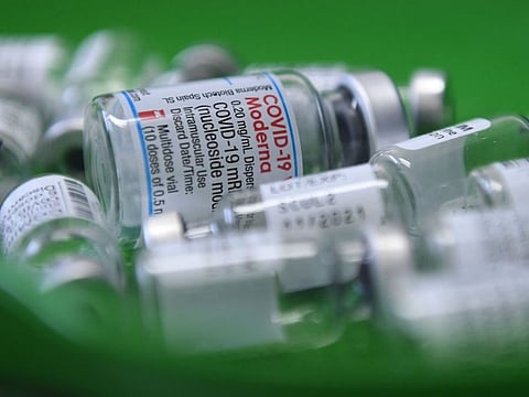Empty vials of the COVID-19 vaccine lie in a tray at a vaccination centre in Sonthofen, southern Germany, on November 30, 2021.