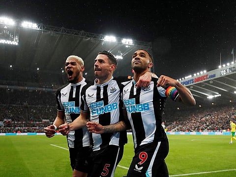 Newcastle United’s Callum Wilson celebrates scoring their goal with Fabian Schar and Joelinton, but it was cancelled out by Norwich.