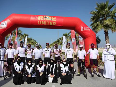 The Maitha Bint Ahmed Al Nahyan Foundation for Community and Cultural Initiatives takes part in the ‘Ride United’ event, alongside the UAE Team Emirates riders on Al Hudayriyat Island on Wednesday.
