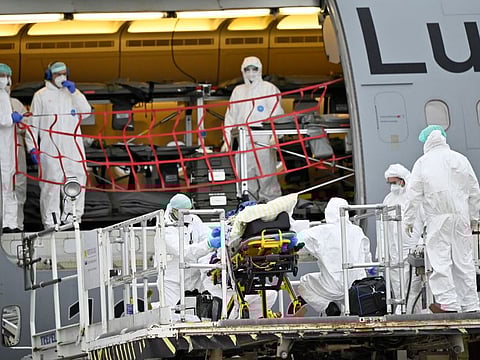 A coronavirus disease (COVID-19) infected patient from a Saxony hospital is transferred from an ambulance car to a Bundeswehr ambulance aircraft Airbus 310 Medevac to be flown to Cologne, at the Dresden airport amid the coronavirus disease (COVID-19) pandemic, in Dresden, Germany, December 1, 2021.