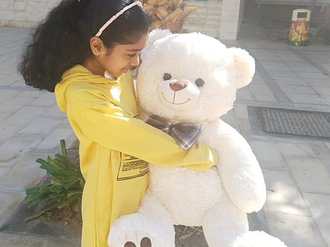 Jhanvi with her new teddy, gifted by a Dubai policeman.