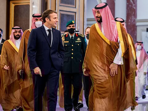 Saudi Crown Prince Mohammed bin Salman receiving French President Emmanuel Macron in Saudi Arabia's Red Sea coastal city of Jeddah on December 4, 2021.