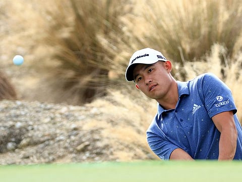 Collin Morikawa of the United States chips in for eagle on the third hole during the third round of the Hero World Challenge at Albany Golf Course in Nassau.