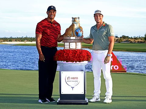 Tiger Woods poses with Viktor Hovland after the Norwegian won the Hero World Challenge at Albany Golf Course in Nassau