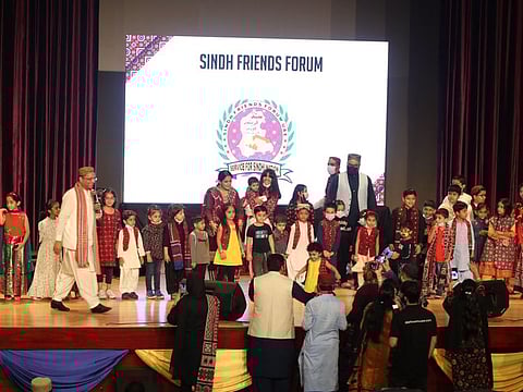 Children in Sindhi cultural dresses were called on stage and gifts distributed among them