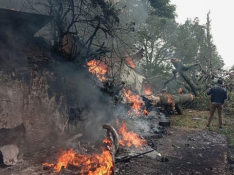 The burning debris of an IAF Mi-17V5 helicopter at the crash site in Coonoor, Tamil Nadu, on December 8, 2021.