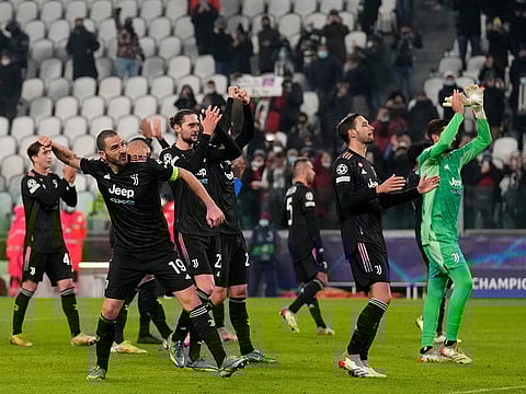 Juventus players celebrate at the end of the victory over Malmo at the Allianz stadium in Turin, Italy, Wednesday, Dec. 8, 2021.