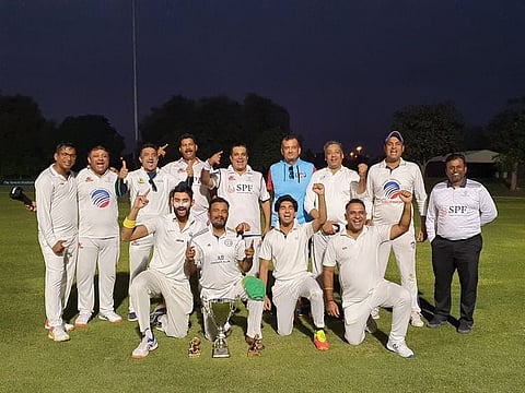 Jubilant members of Jumeirah Mammoths with winners' trophy of the league.