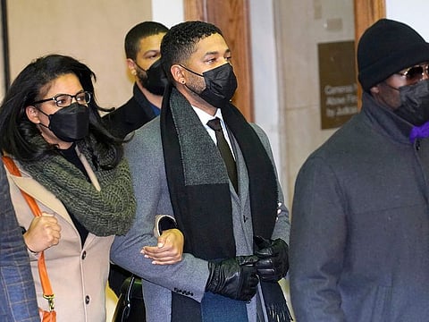 Actor Jussie Smollett departs the Leighton Criminal Courthouse Thursday, Dec. 9, 2021, after a jury found Smollett guilty on five of six charges he staged a racist, anti-gay attack on himself and then lied to Chicago police about it.
