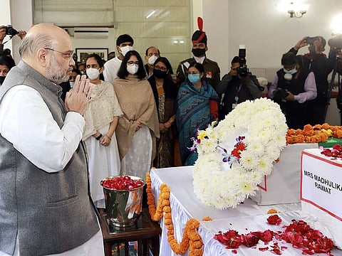 Union Home Minister Amit Shah pays last respects to the mortal remains of Chief of Defence Staff (CDS) General Bipin Rawat and his wife Madhulika Rawat, at their residence, in New Delhi on Friday. CDS General Bipin Rawat and his wife lost their lives in the IAF Coonoor chopper crash.
