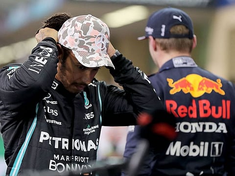 Lewis Hamilton alongside Max Verstappen in Abu Dhabi.