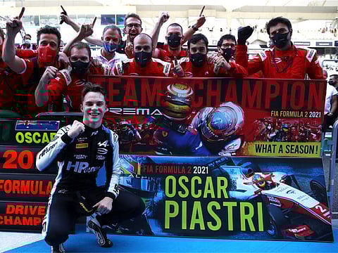 Oscar Piastri celebrates the Formula Two World Championship at Yas Marina Circuit