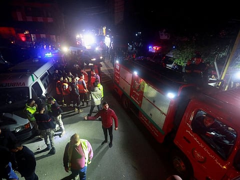 Ambulances and firefighting vehicles at the Palestinian camp after an explosion took place, in the southern Lebanese port city of Tyre, on December 10, 2021.
