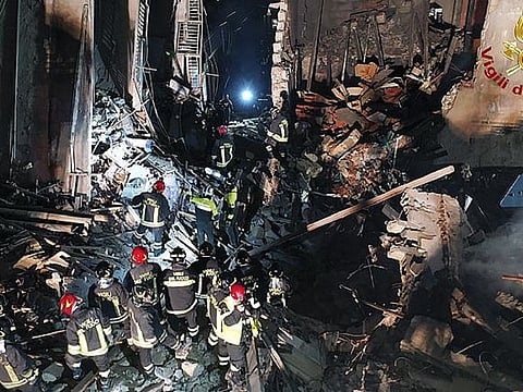 Italian firefighters and rescuers search for survivors among the rubble of a collapsed building, in Ravanusa, Sicily, Italy.