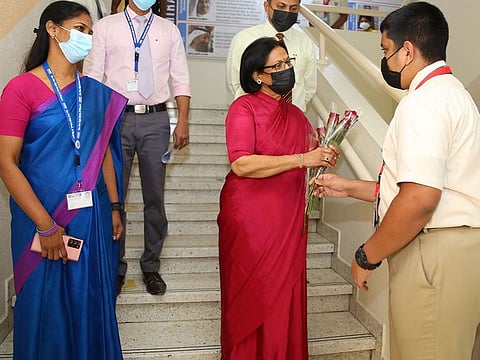 Daisy Justus (centre) receiving well wishes from a student