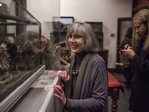 Anne Rice looks at taxidermic creatures on display at the Morbid Anatomy Museum in New York, Nov. 28, 2016. Rice, the Gothic novelist best known for her best-selling book “Interview With the Vampire,” died on Saturday, Dec. 11, 2021. She was 80.