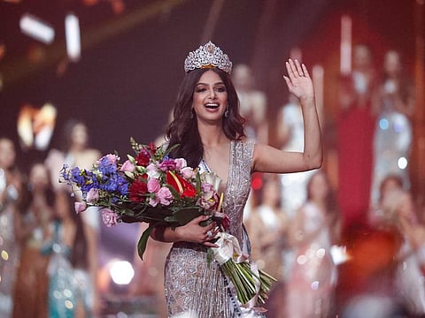 India's Harnaaz Sandhu waves after being crowned Miss Universe 2021 during the 70th Miss Universe pageant, Monday, Dec. 13, 2021, in Eilat, Israel.