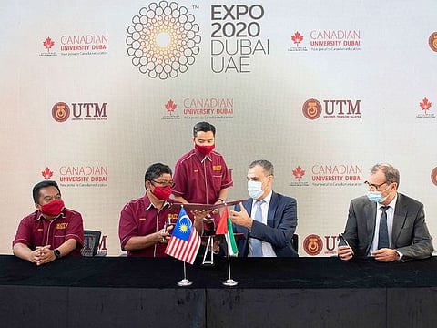 Assoc. Prof. Dr. Mohd Ismid Md Said - Pro Vice-Chancellor (International), Universiti Teknologi Malaysia, Prof. Dr. Mohd Hamdan Ahmad – Deputy Vice-Chancellor (Development), Universiti Teknologi Malaysia, Prof. Karim Chelli, President & Vice-Chancellor, Canadian University Dubai and Dr. Mohammed Djeddi, Vice-President Academic Affairs, Canadian University Dubai, at the signing ceremony