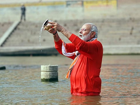India's Prime Minister Narendra Modi offering prayer to river Ganga, in Varanasi on Monday