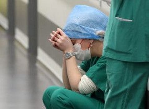 Doctor Ruxandra Divan, rests in the Intensive Care Unit (ICU) for COVID-19 patients at "Hopitaux Civils de Colmar" in Colmar, France, December 15, 2021.